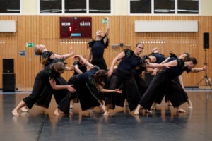 a group of women dancing in a room