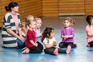 a group of children sitting on the floor